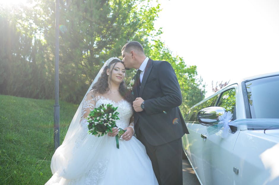 pexels photo 35302403 35302403 Bride and groom sharing a tender moment by a limousine in a lush outdoor setting.